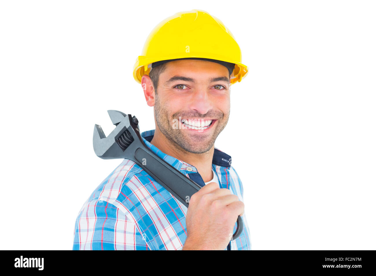 Smiling manual worker holding adjustable spanner Stock Photo