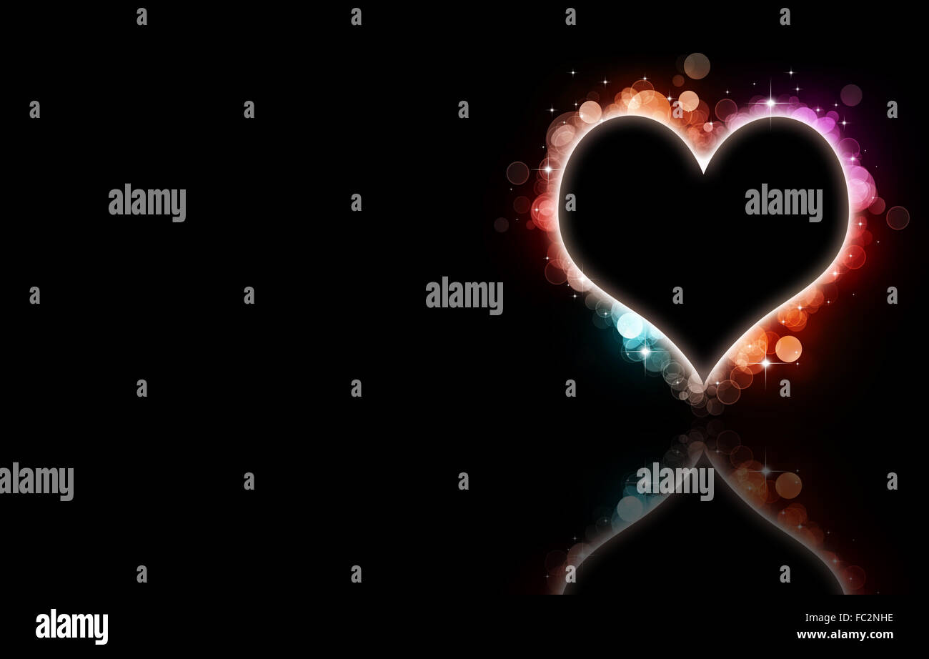 abstract multicolor bokeh heart on black background Stock Photo