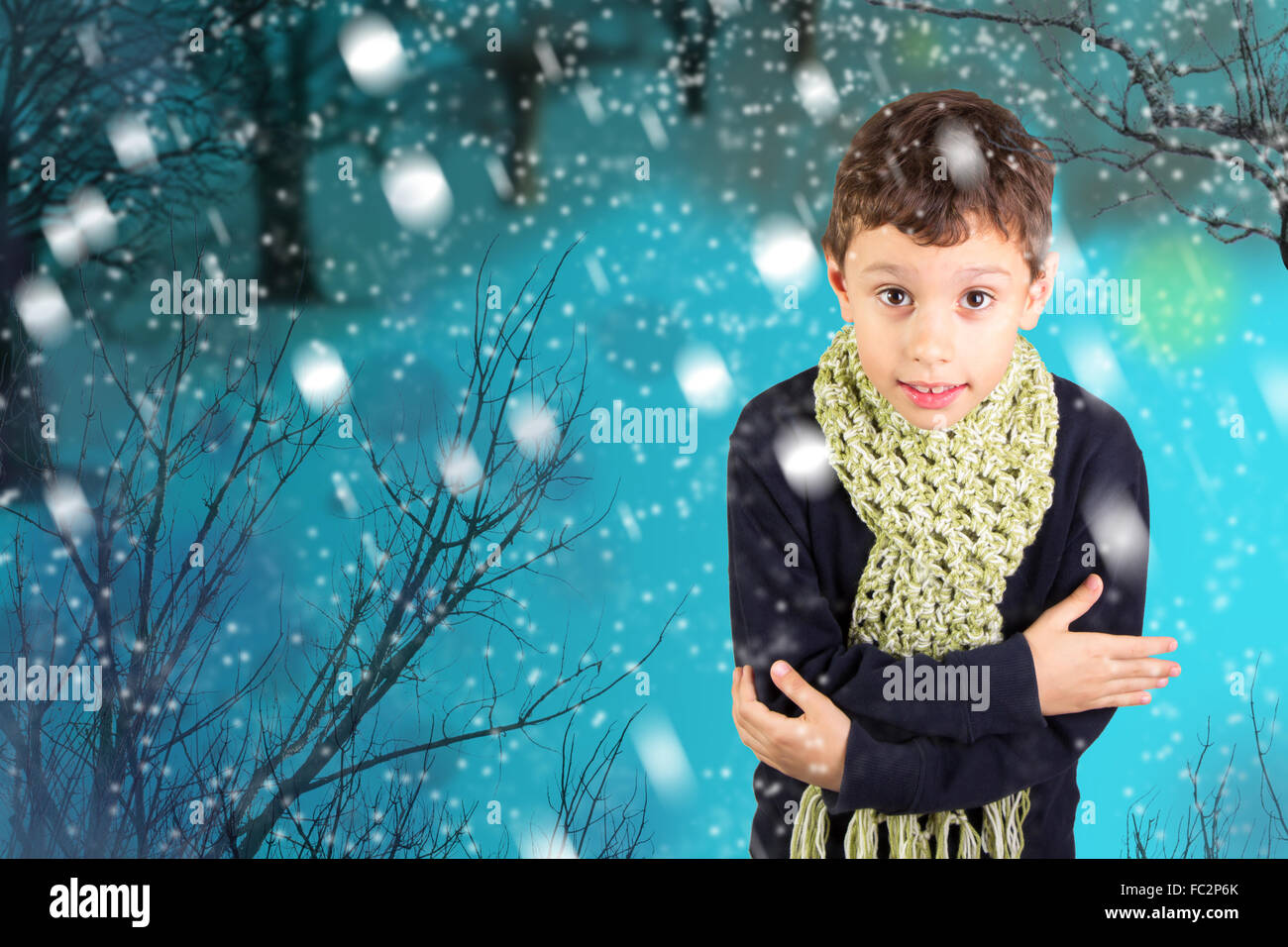 Little boy feeling cold under snow Stock Photo Alamy