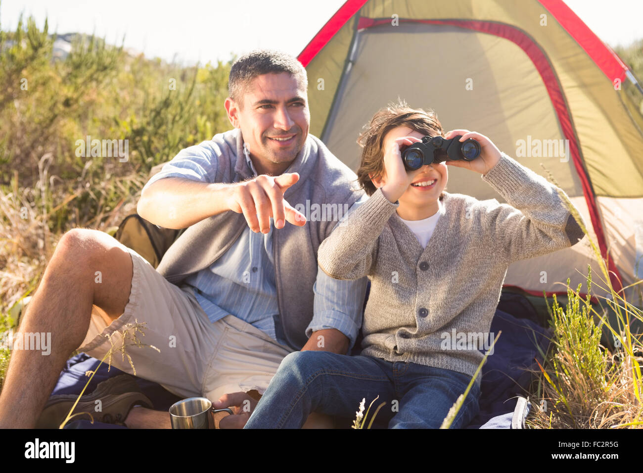 Father and son beside their tent in the countryside Stock Photo - Alamy