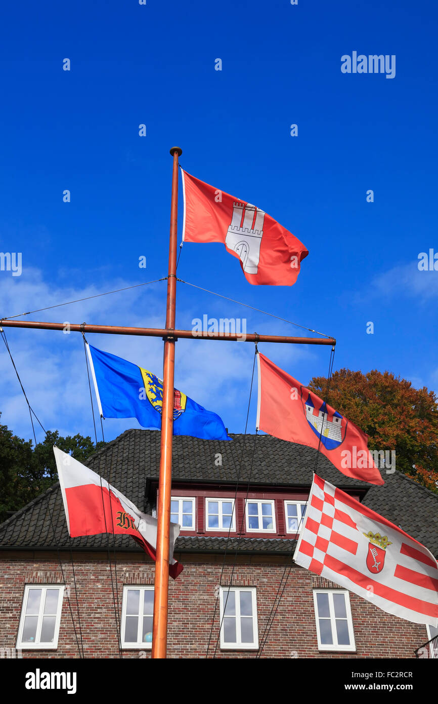 Old house with flags at Elbe river,  Oevelgoenne, Hamburg, Germany, Europe Stock Photo