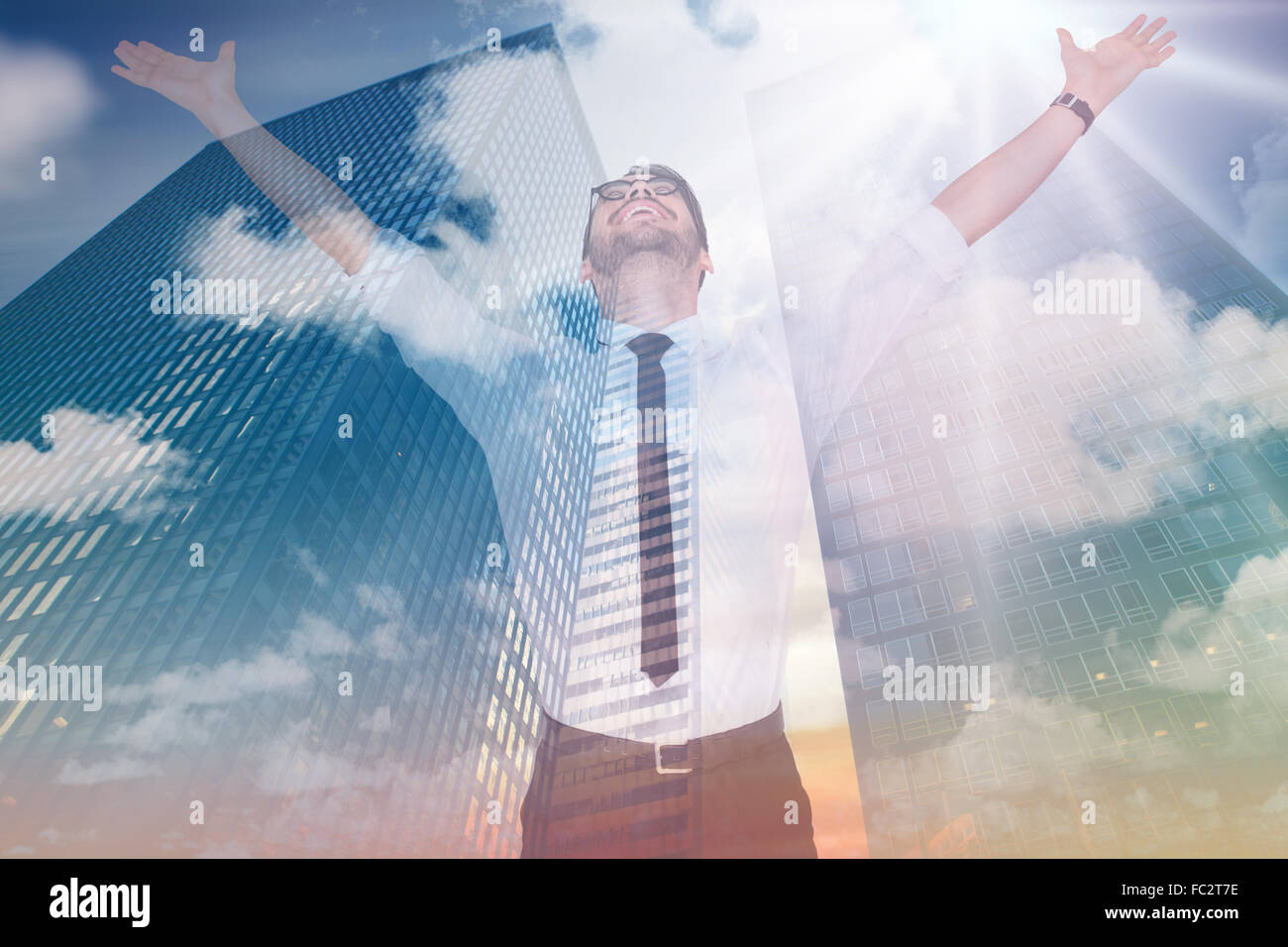 Composite image of cheering businessman with his arms raised up Stock ...