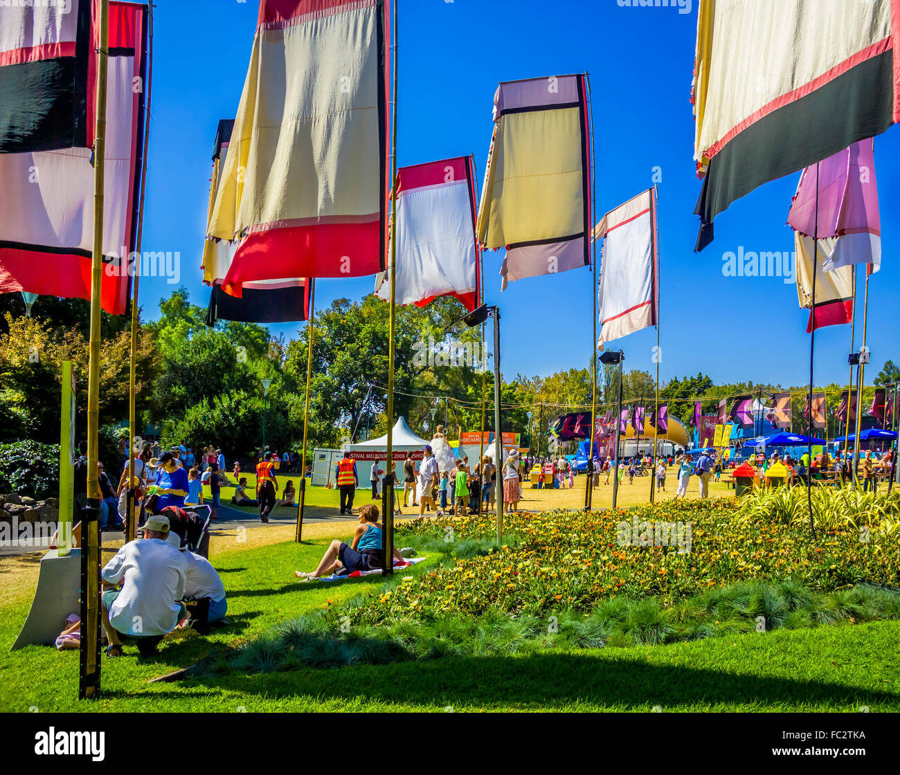 Colourful flags created by artist Angus Watt waving in the wind at