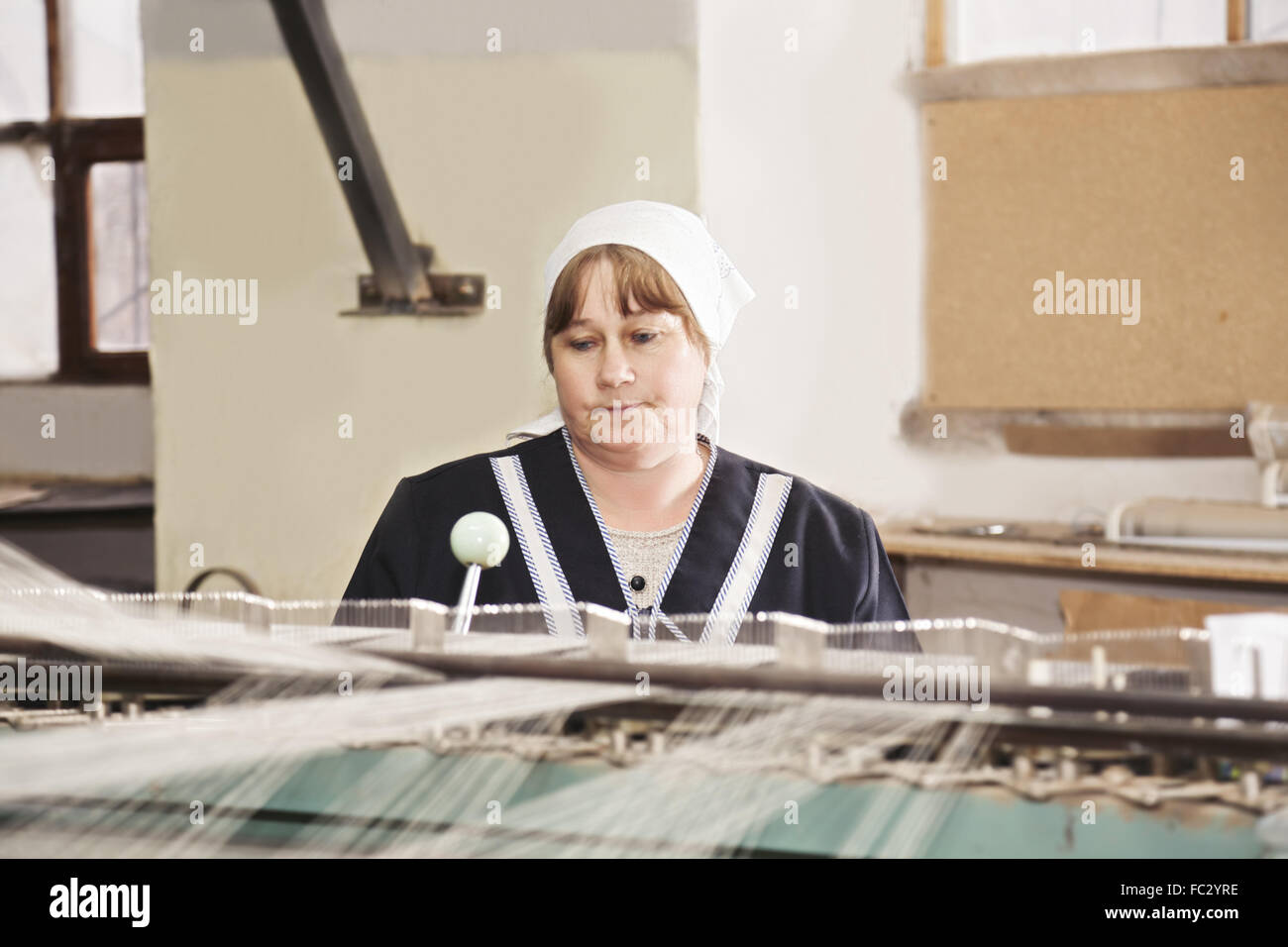 Elderly worker at factory Stock Photo