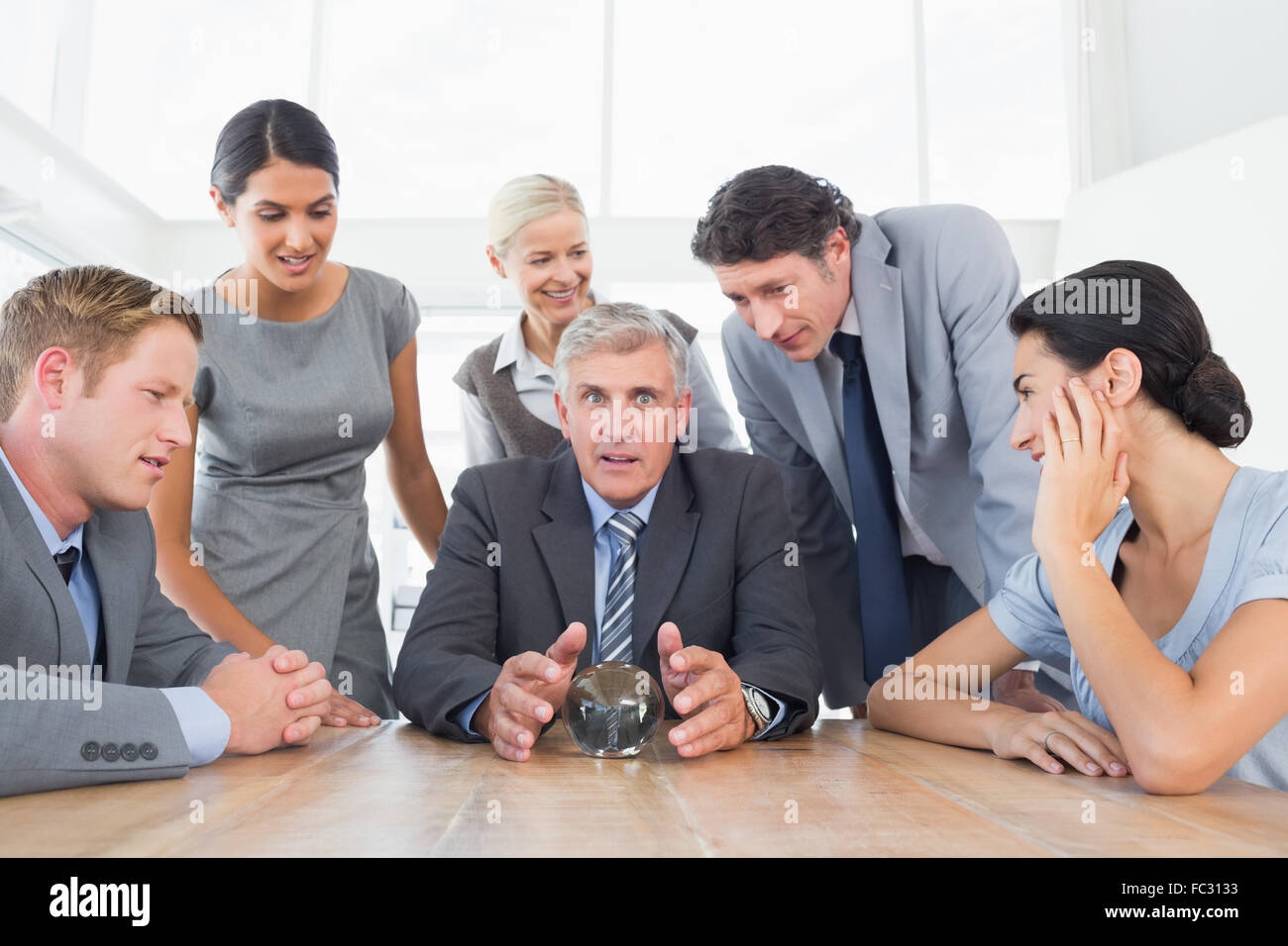 Businessman forecasting the future with his crystal ball Stock Photo ...