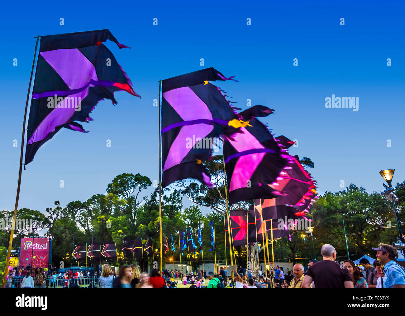 Colourful flags created by artist Angus Watt waving in the wind at