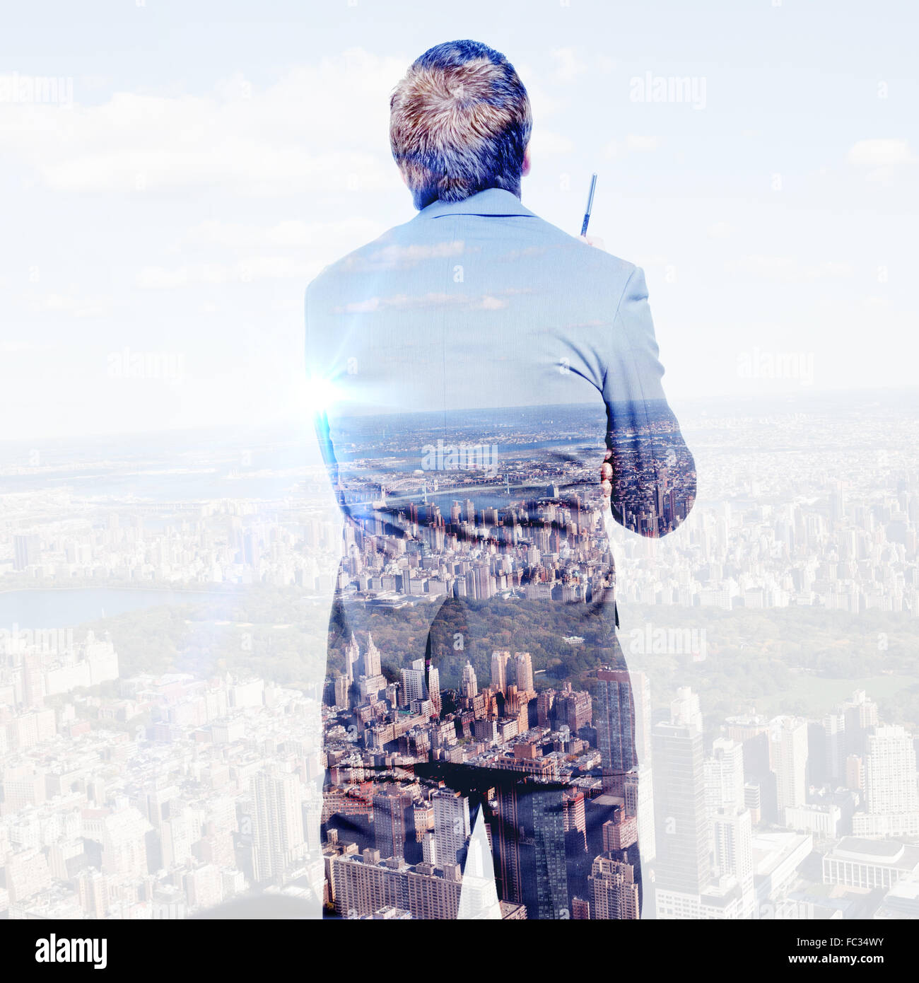Composite image of thoughtful businessman holding pen Stock Photo - Alamy