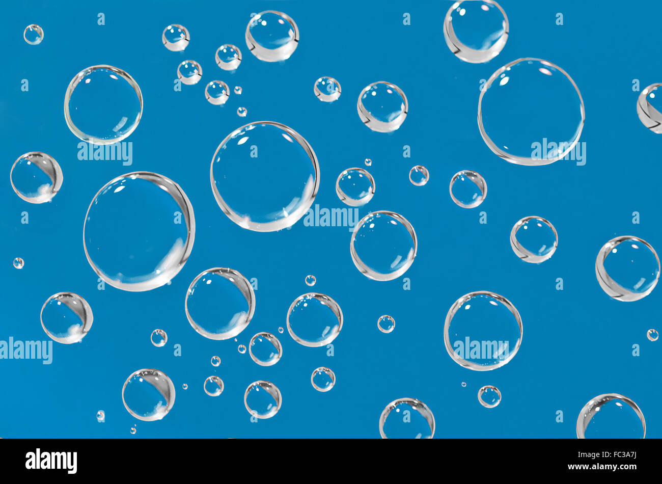 Water droplets on a blue background Stock Photo - Alamy