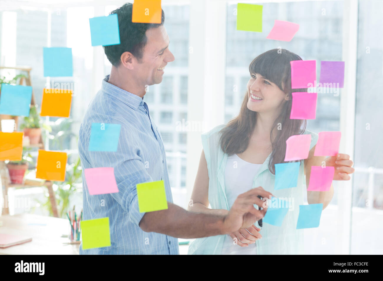 Young creative business people writing photo editor Stock Photo Alamy