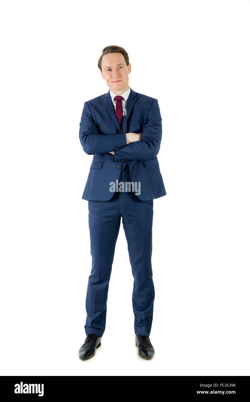 Happy businessman looking at camera with arms crossed Stock Photo - Alamy