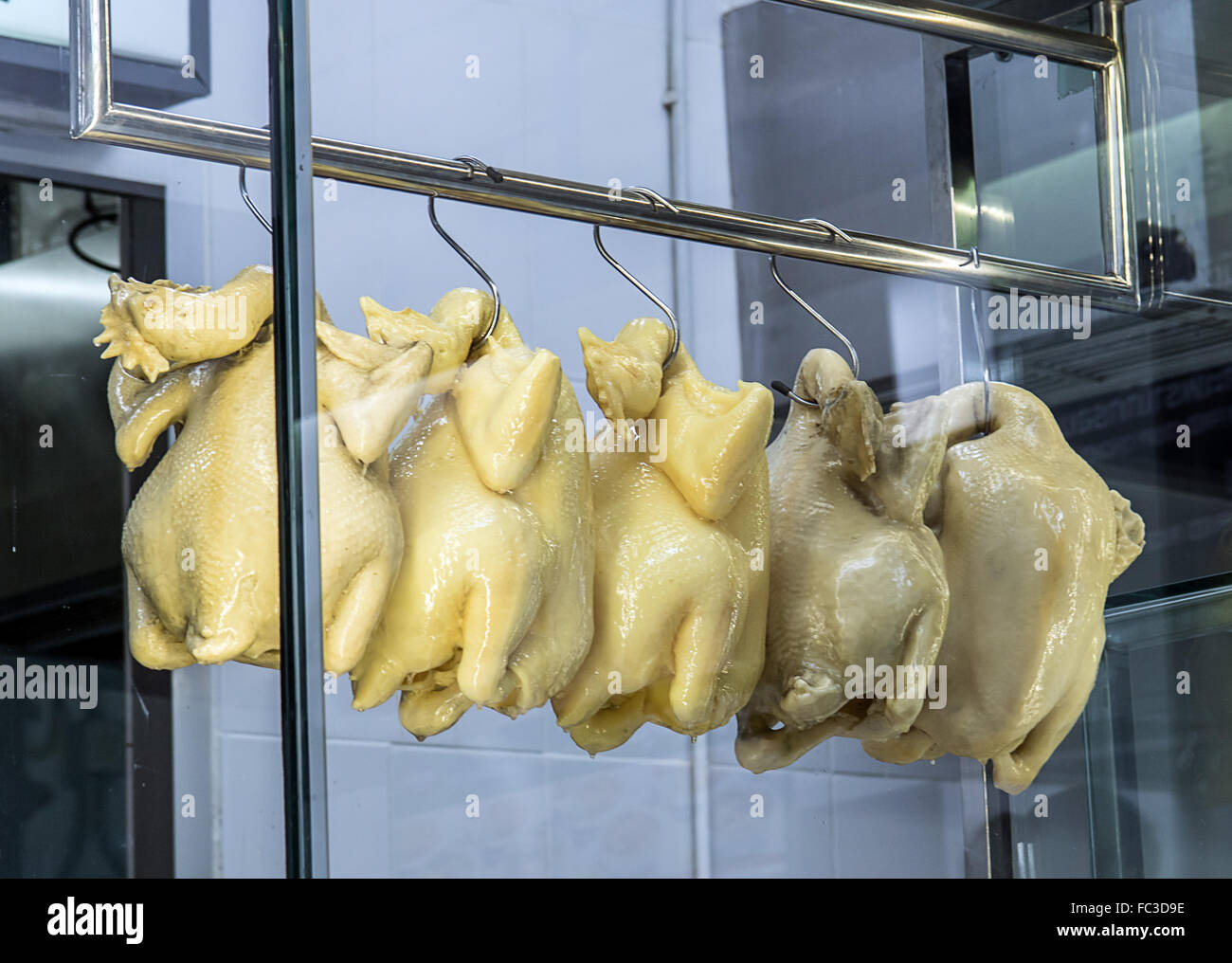 Raw chicken hanging on hook hires stock photography and images Alamy