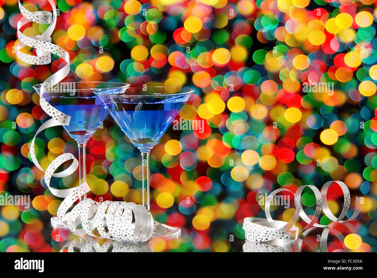 two liqueres glasse with a lot  of colored confetti Stock Photo