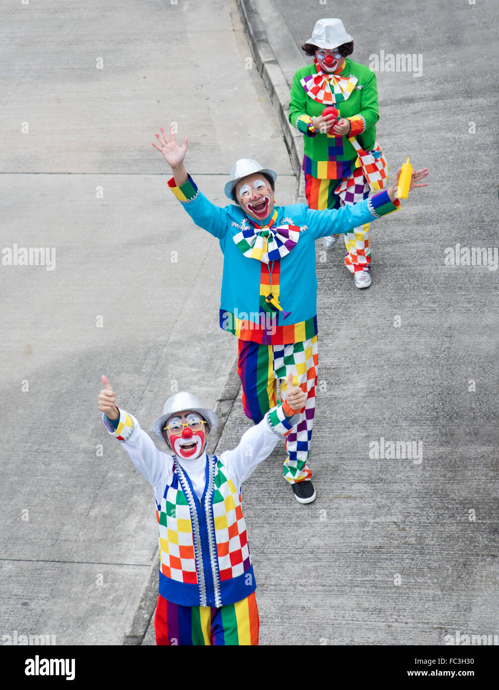 clowns cheering on the street at  Ngong Ping Village Stock Photo