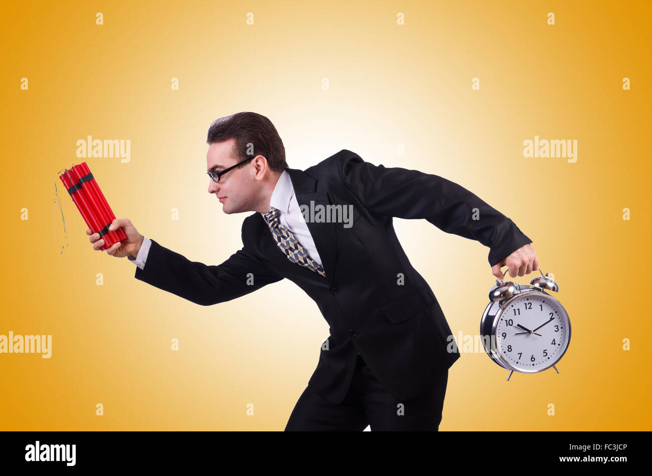 Man with time bomb isolated on white Stock Photo