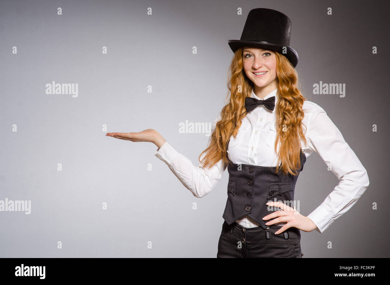 Pretty girl wearing retro hat isolated on gray Stock Photo - Alamy