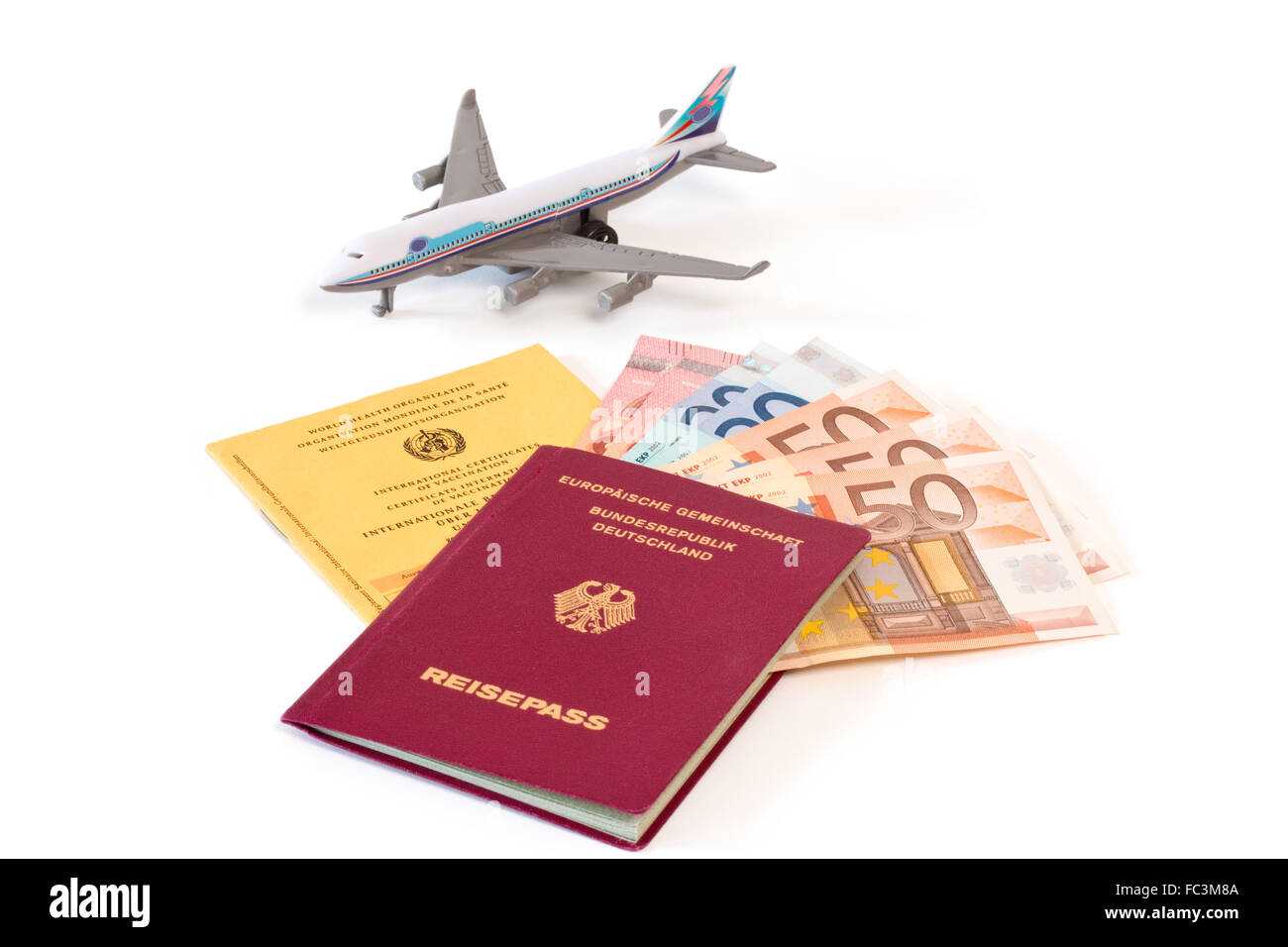 Passport with money and vaccination card Stock Photo