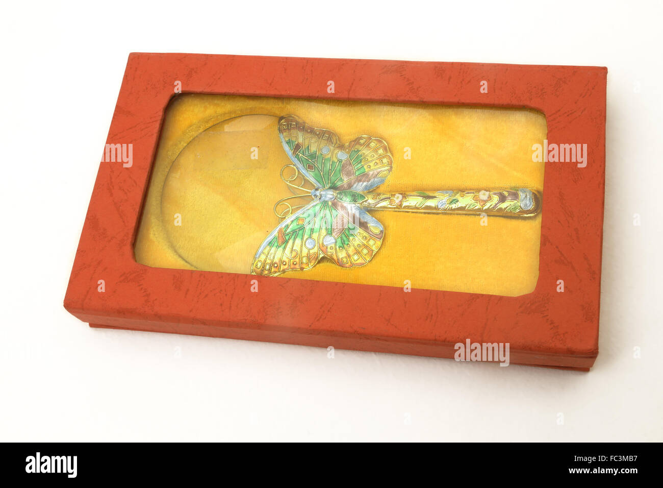Magnifying Glass With Cloisonne Enamel Butterfly Design Stock Photo