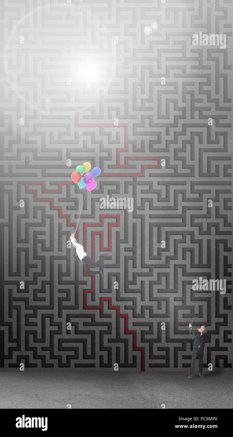 Composite image of businessman shooting a bow and arrow Stock Photo Alamy