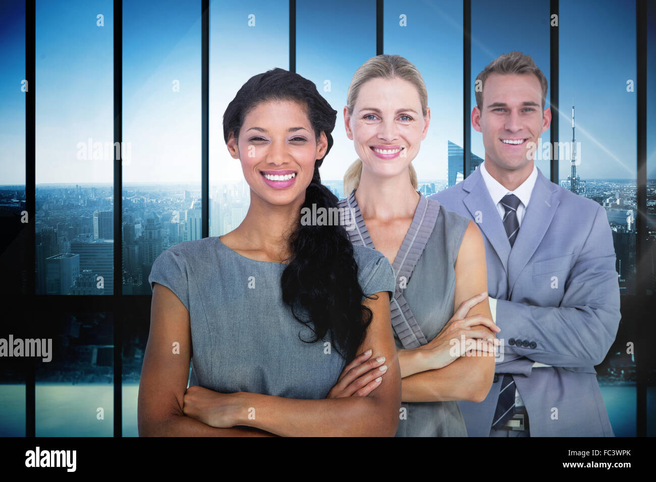 Composite image of happy business team smiling at camera Stock Photo ...