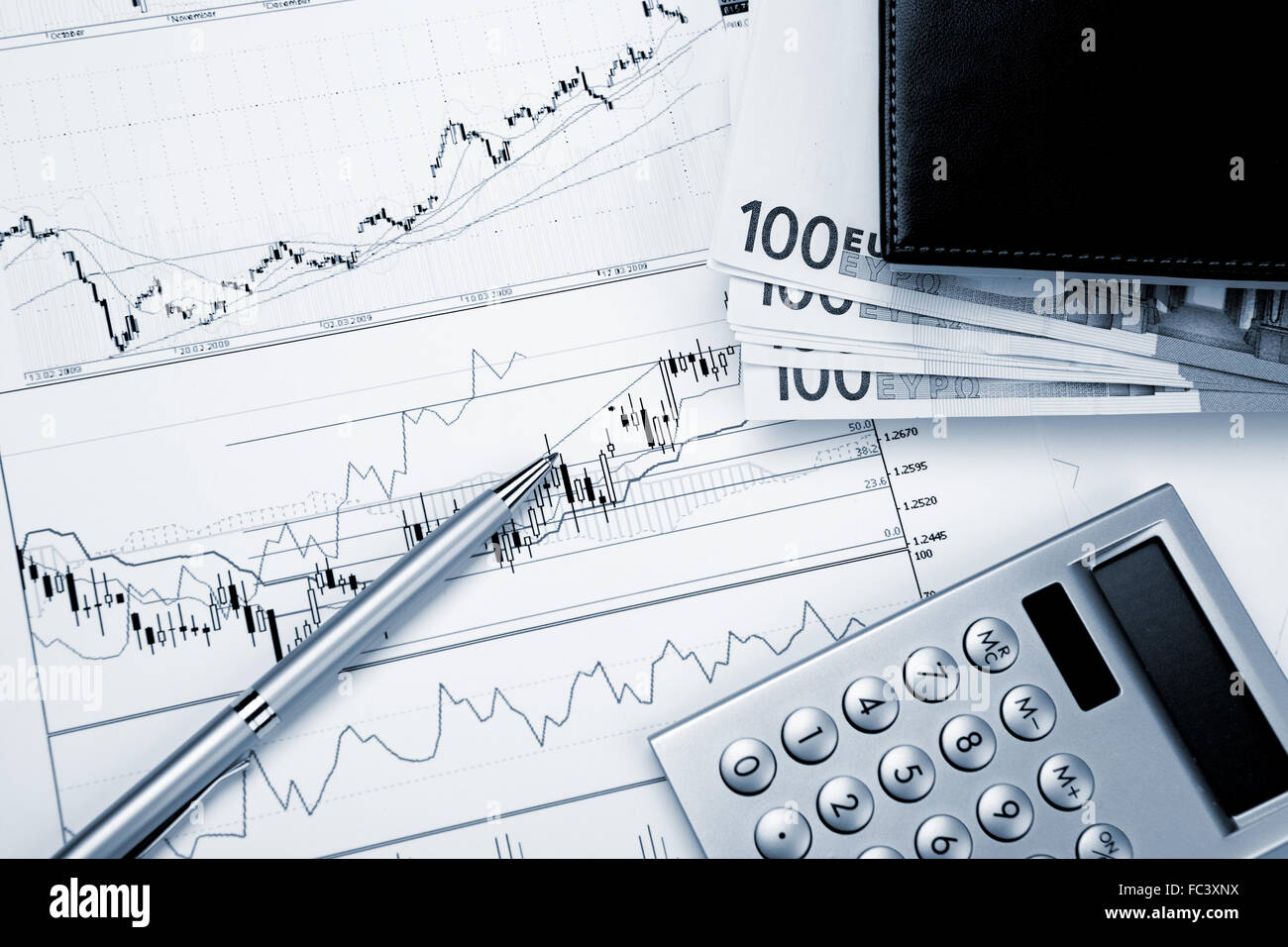 financial charts and graphs on the table Stock Photo - Alamy