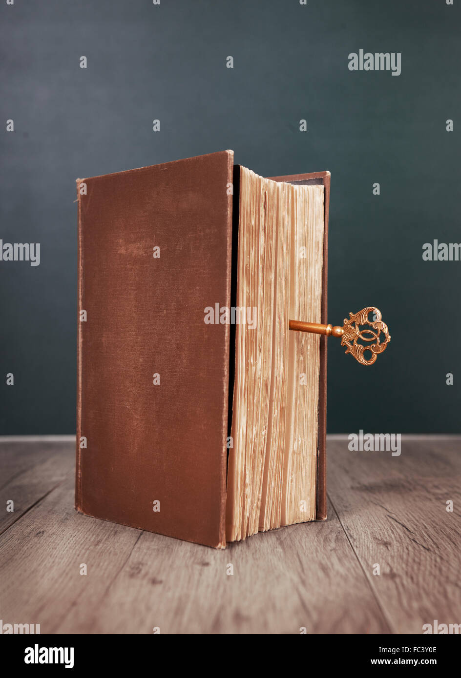 an old book closed with a key Stock Photo