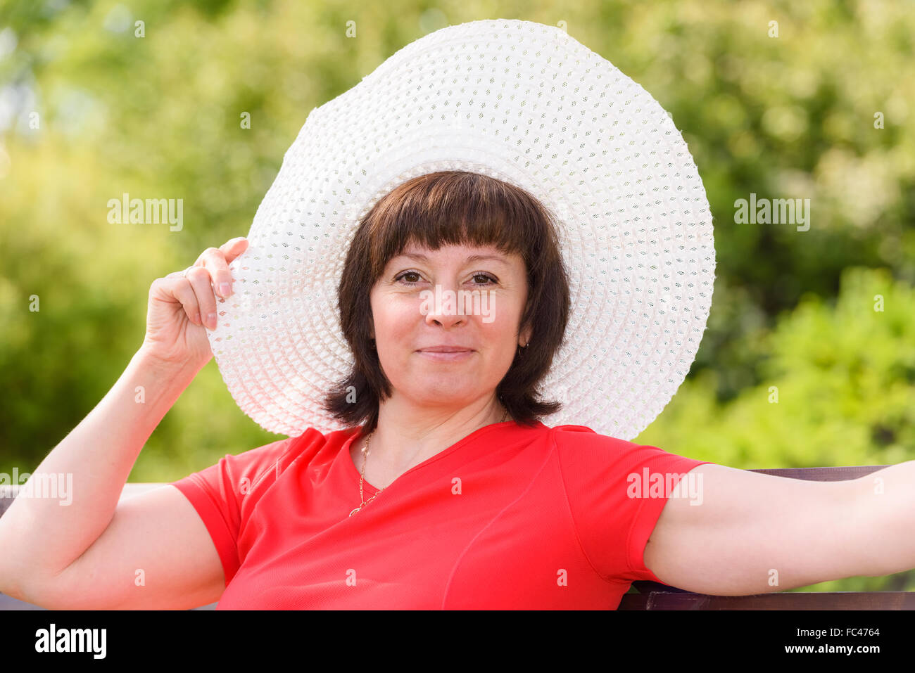A middle-aged brunette white hat Stock Photo