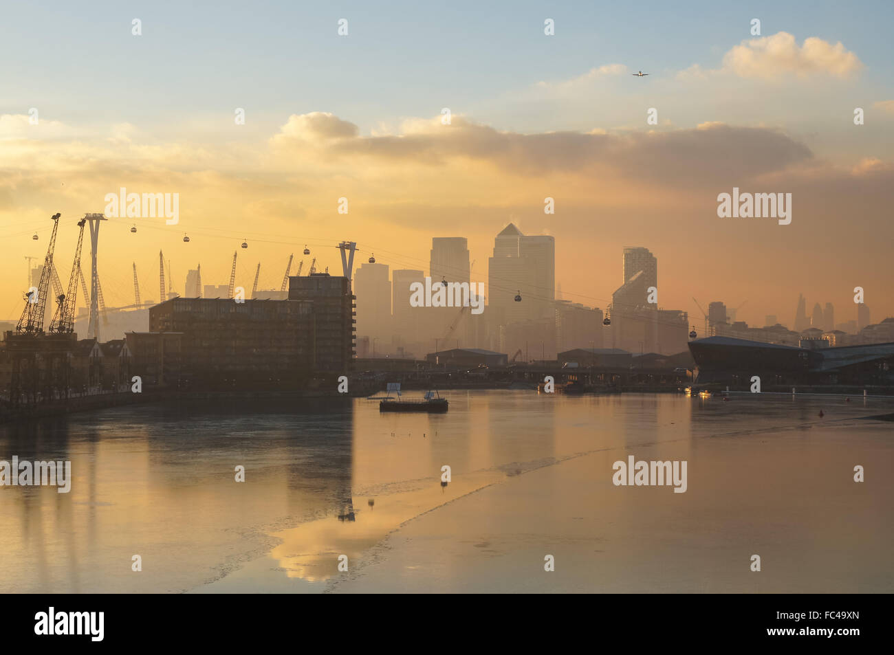 Sunset over London Docklands and Royal Victoria Dock, London England United Kingdom UK Stock Photo