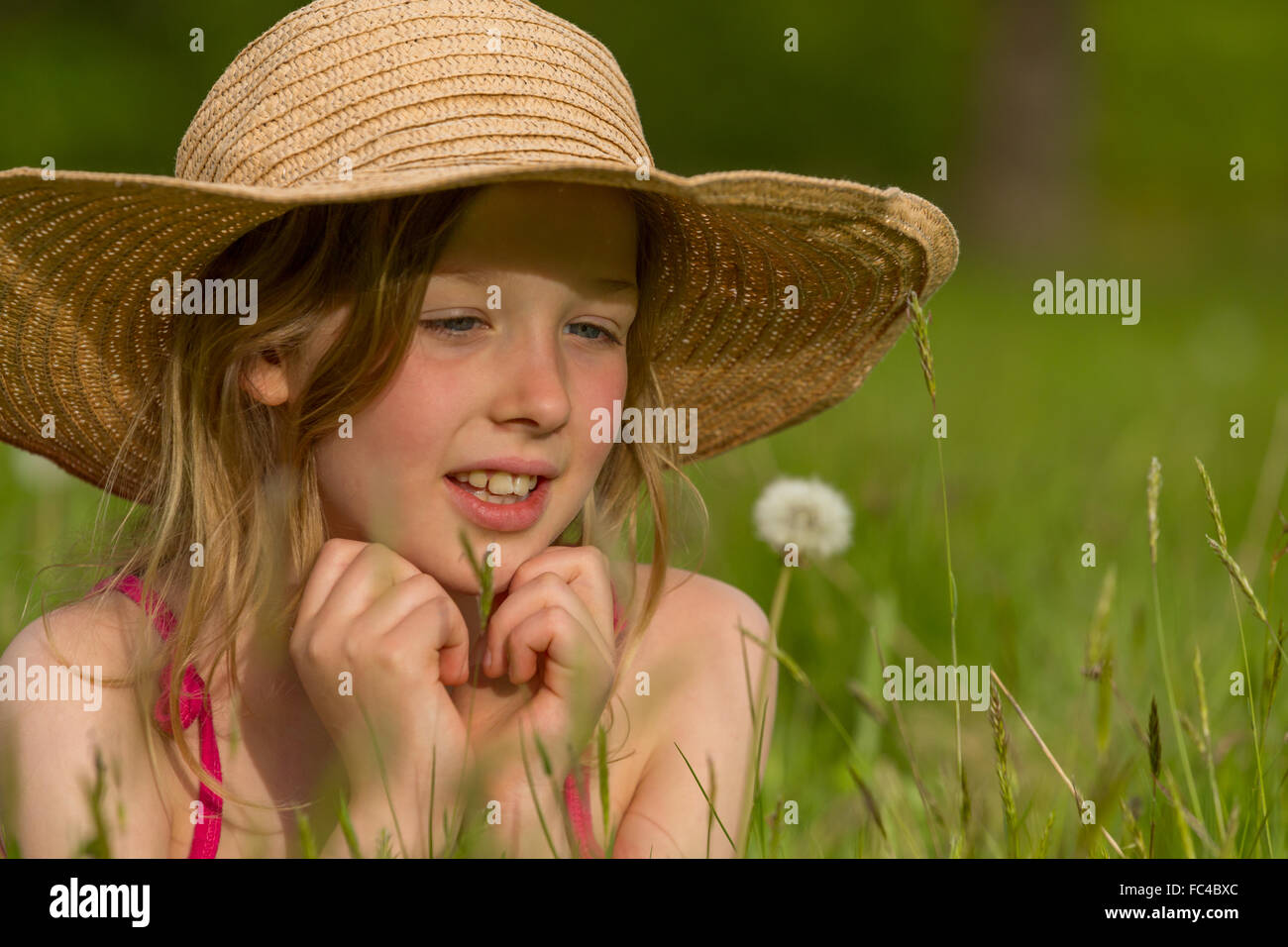 portrait of a little girl with a dandelion Stock Photo - Alamy