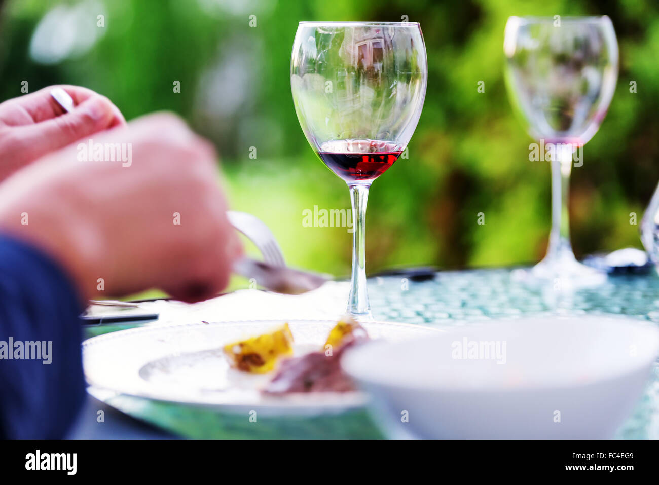 Glasses of red wine at restaurant concept Stock Photo