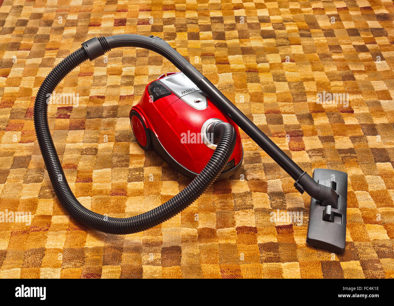 Vacuum cleaner on carpet Stock Photo Alamy