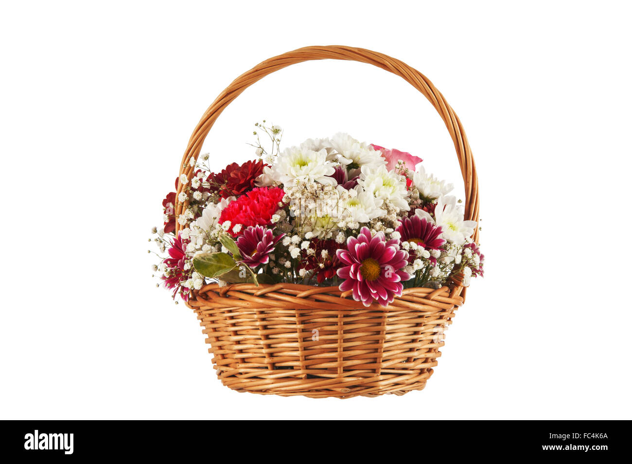 Beautiful bouquet of bright flowers in basket isolated on white background. Stock Photo