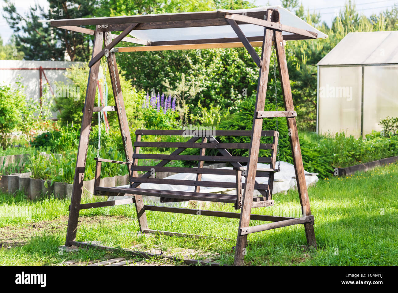 Empty rustic wooden bench swing hi-res stock photography and images - Alamy