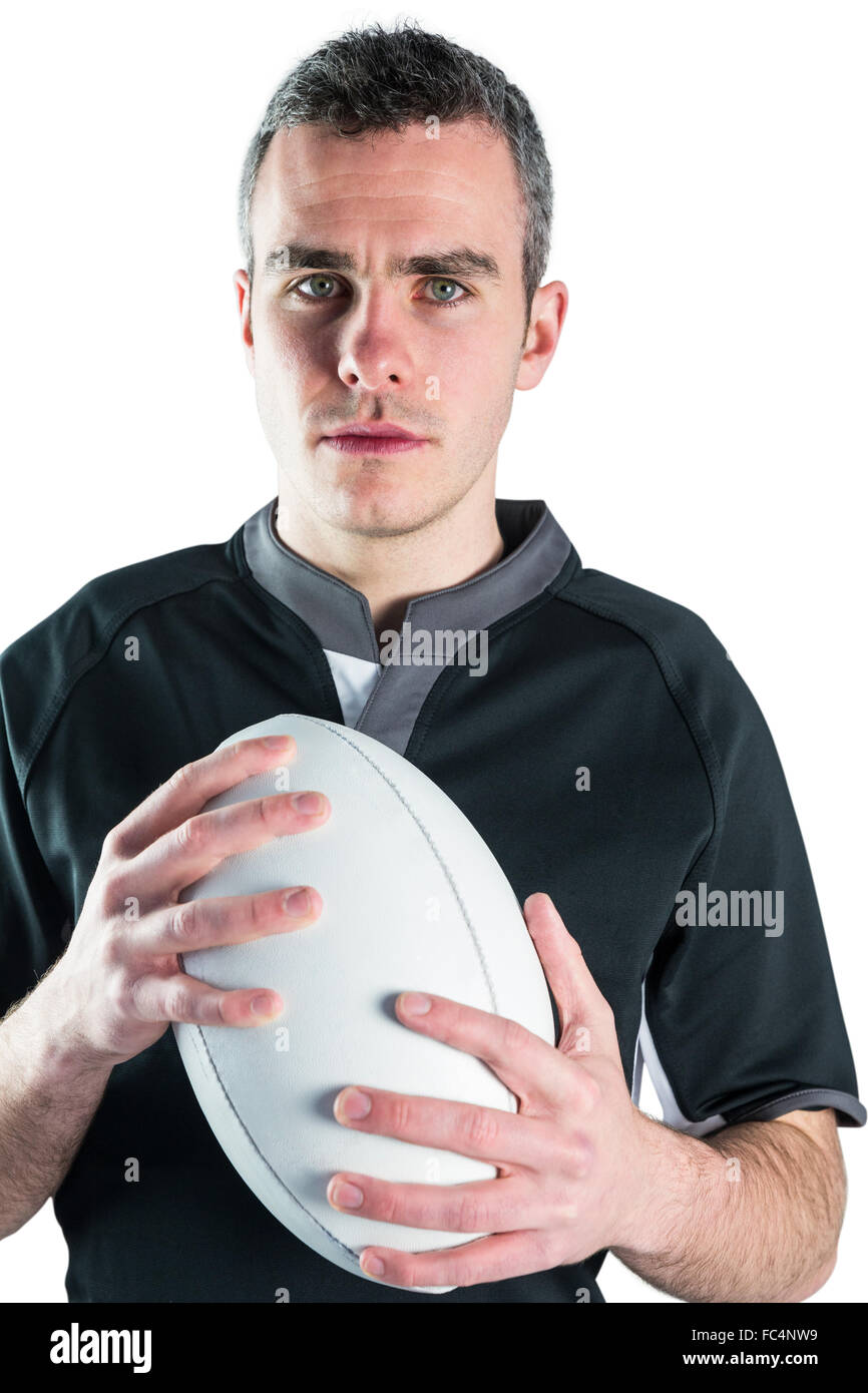 Rugby player holding a rugby ball Stock Photo Alamy