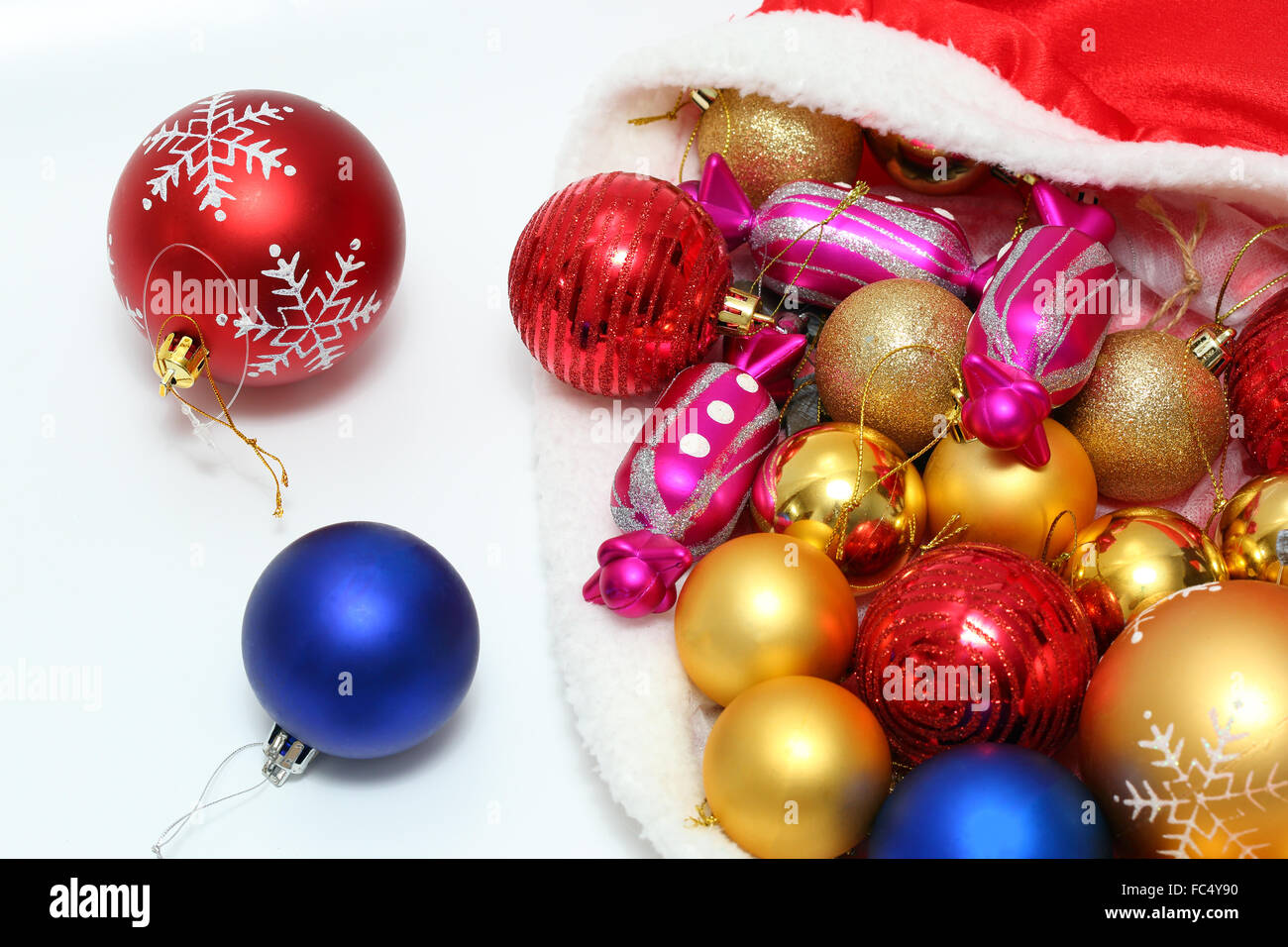 Bright christmas baubles, toys in bag Stock Photo