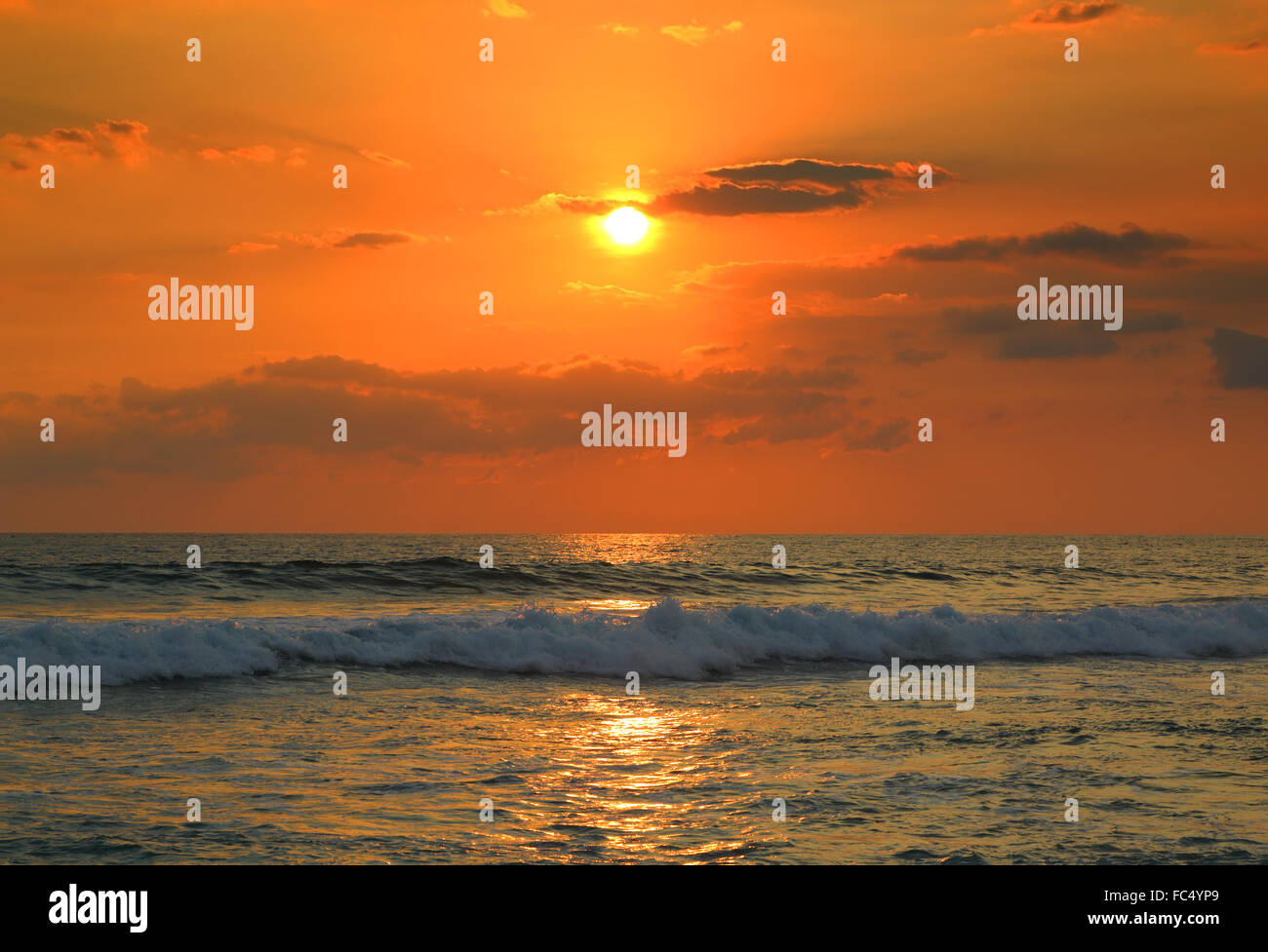 tropical sea sunset and waves Stock Photo - Alamy