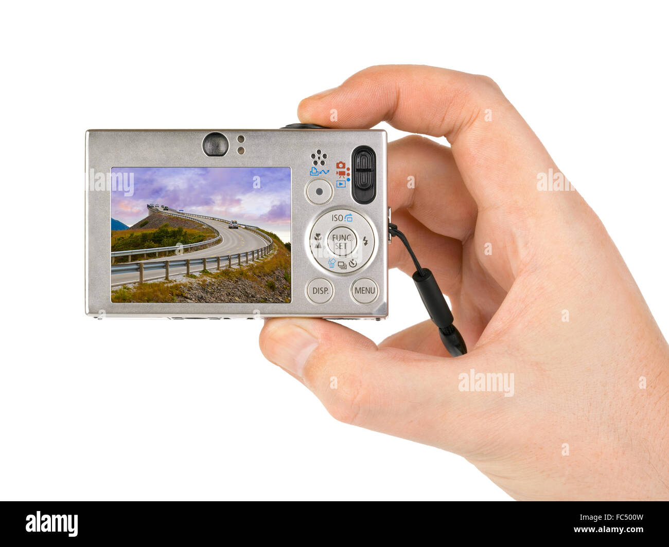 Hand with camera and Norway travel photo Stock Photo