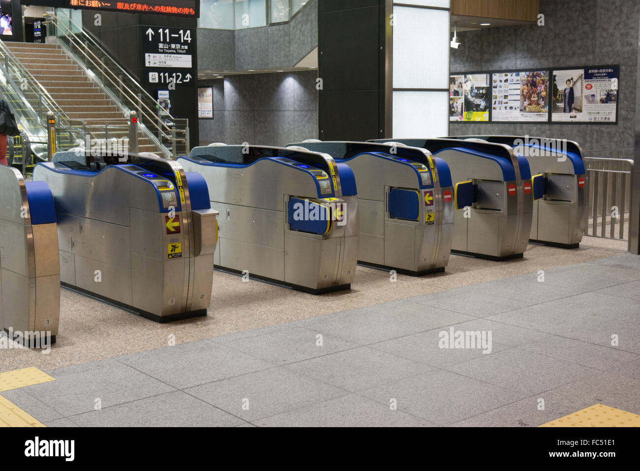 Japan automated turnstiles at train station Stock Photo