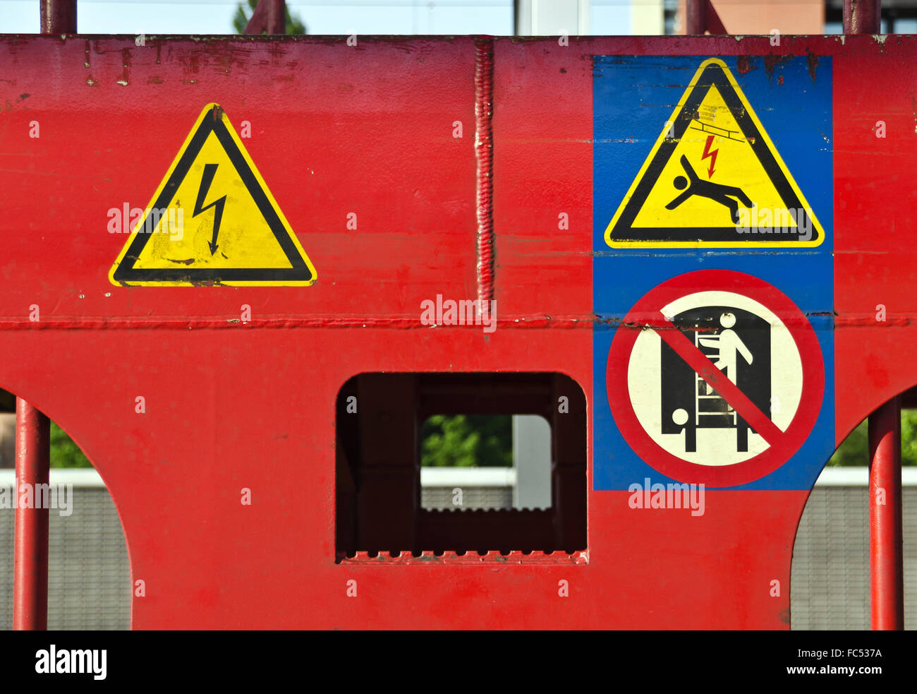 warning signs at a red painted train waggon Stock Photo