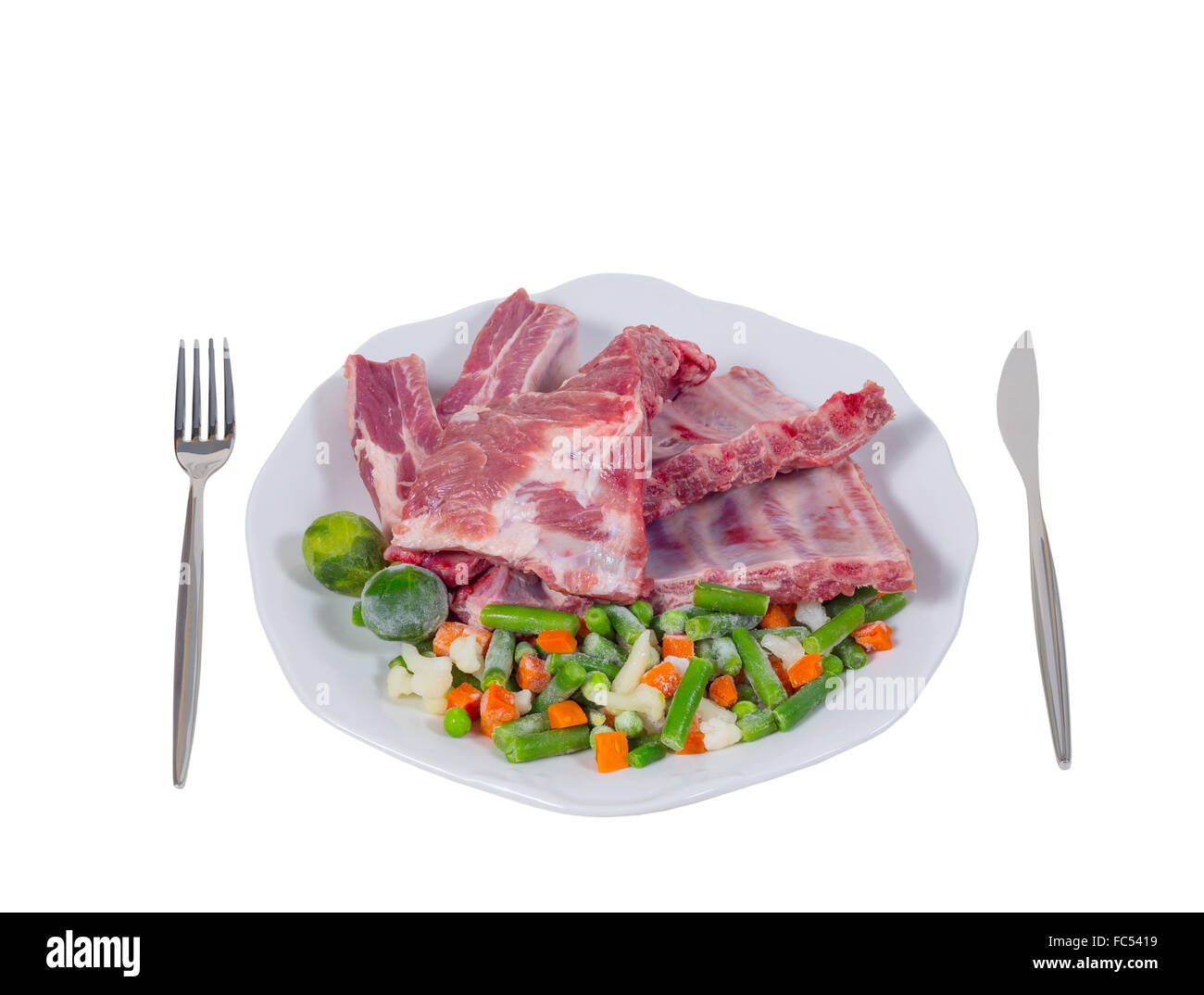 raw meat and vegetables on a plate Stock Photo Alamy