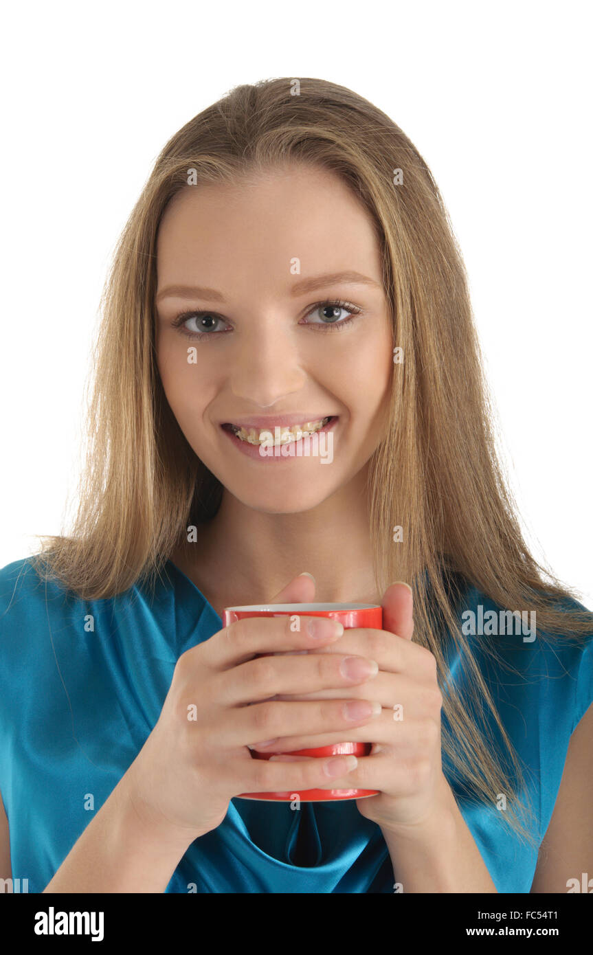 Woman with brackets on teeth and cup Stock Photo