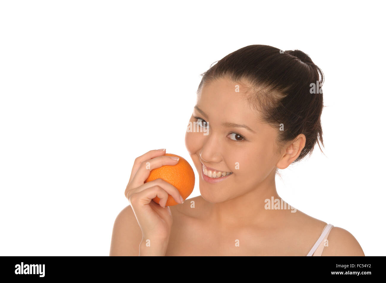 smiling asian woman with orange Stock Photo