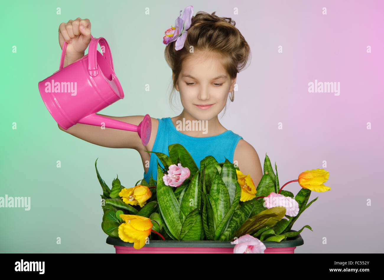 Happy girl watering flowers Stock Photo Alamy