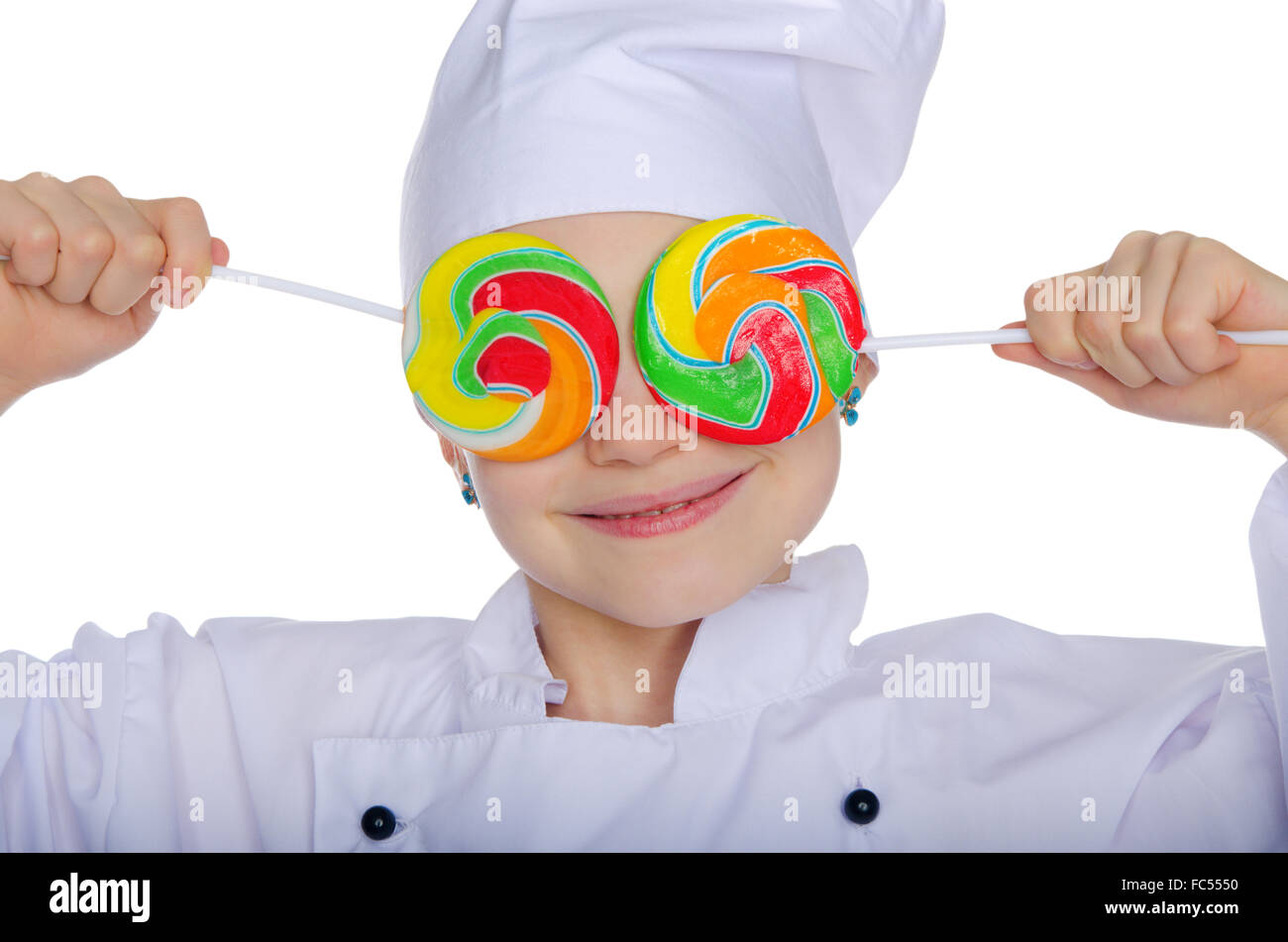Young chef closed his eyes colored candies Stock Photo