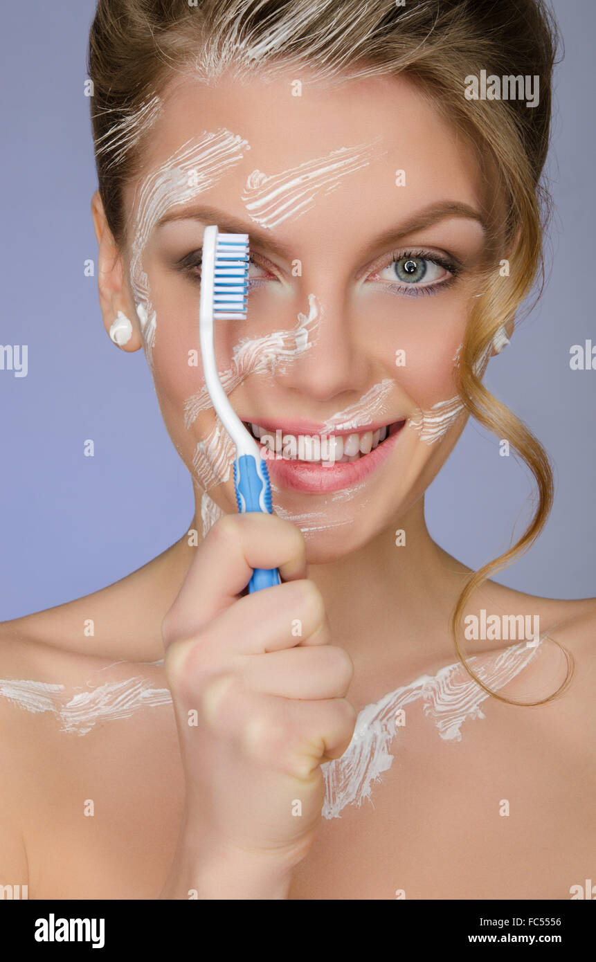 young woman with toothbrush and toothpaste Stock Photo Alamy