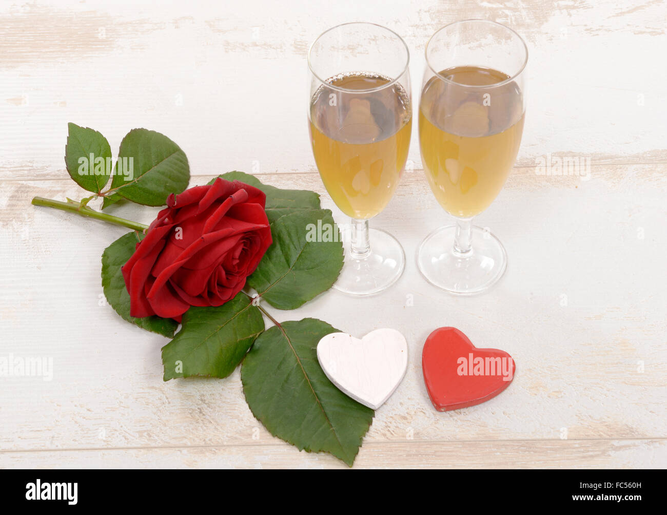 Two champagne glasses red roses hi-res stock photography and images - Alamy