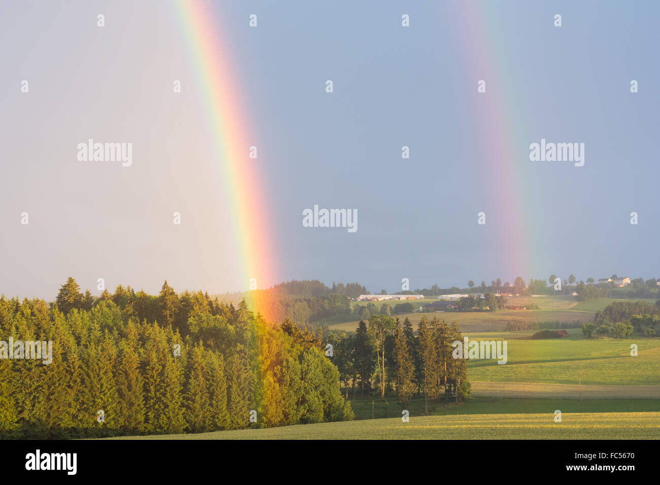 Double Rainbow at summer rain Stock Photo