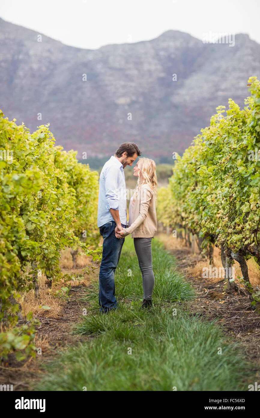 Young happy couple holding hands Stock Photo - Alamy