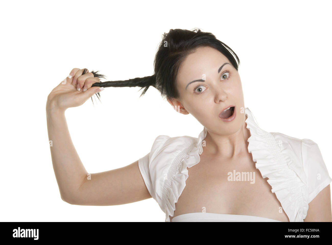 Young woman pulls itself for plait Stock Photo