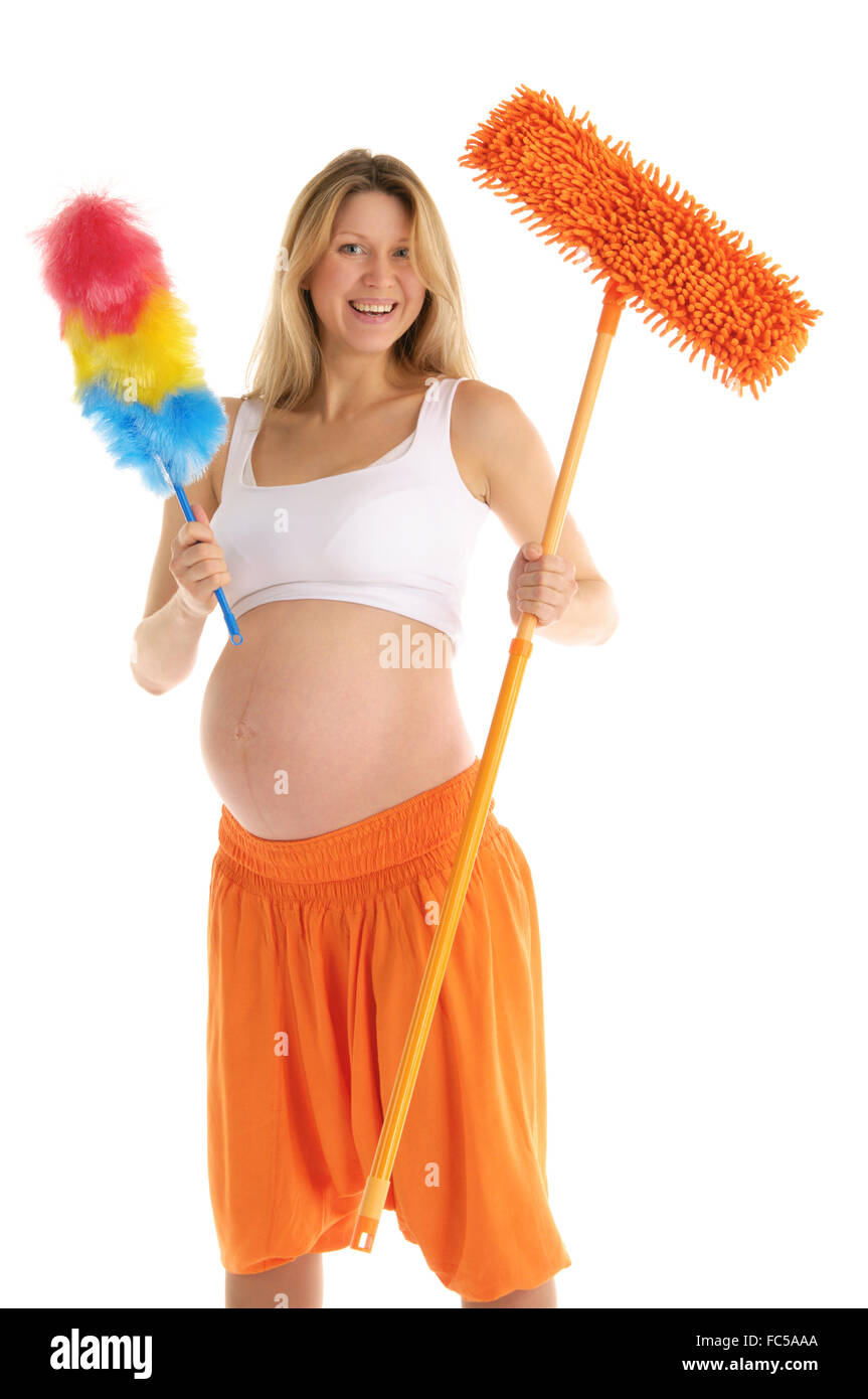 happy pregnant woman with a mop and brush Stock Photo Alamy