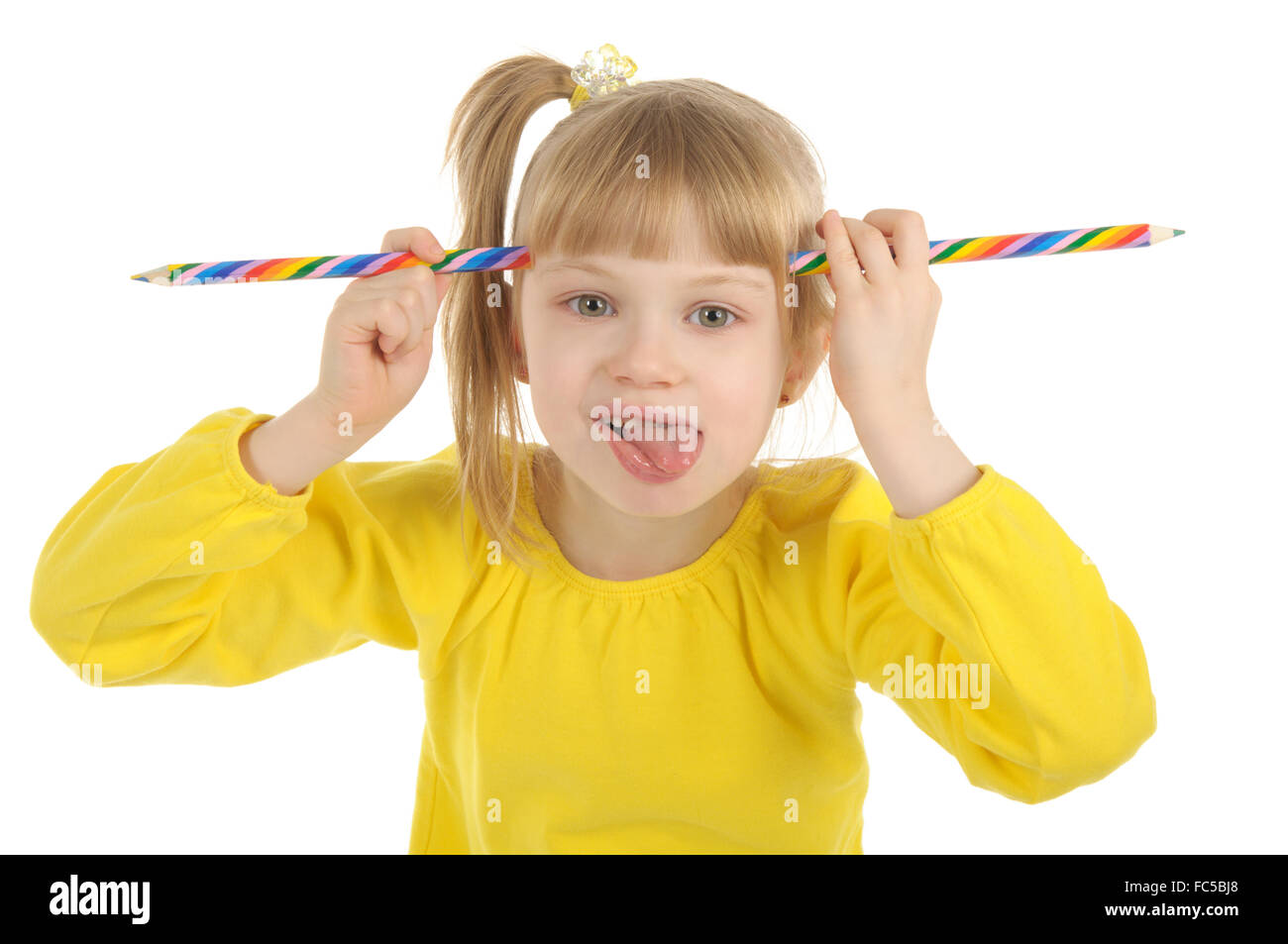 Little girl with colour pencils Stock Photo